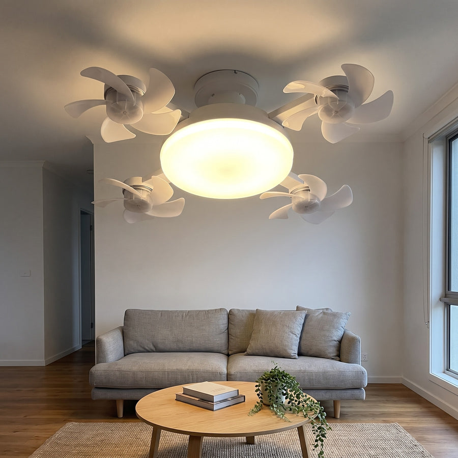 Novu Quad Fan lighting a neutral modern living room above a grey sofa in the early evening