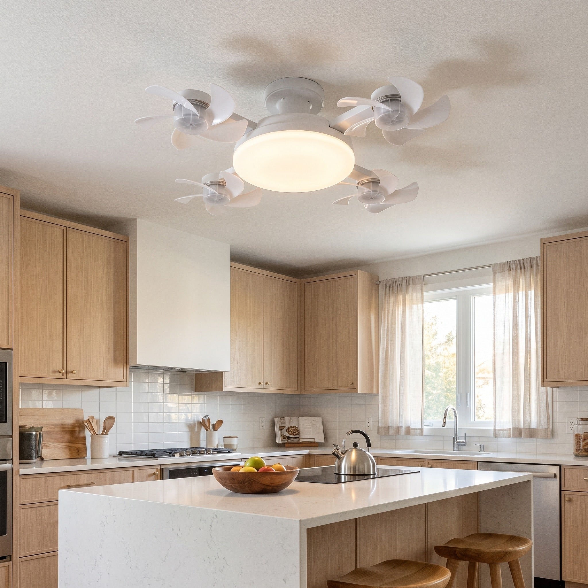 Novu Quad Fan installed on the ceiling of a bright modern kitchen above a white quartz island